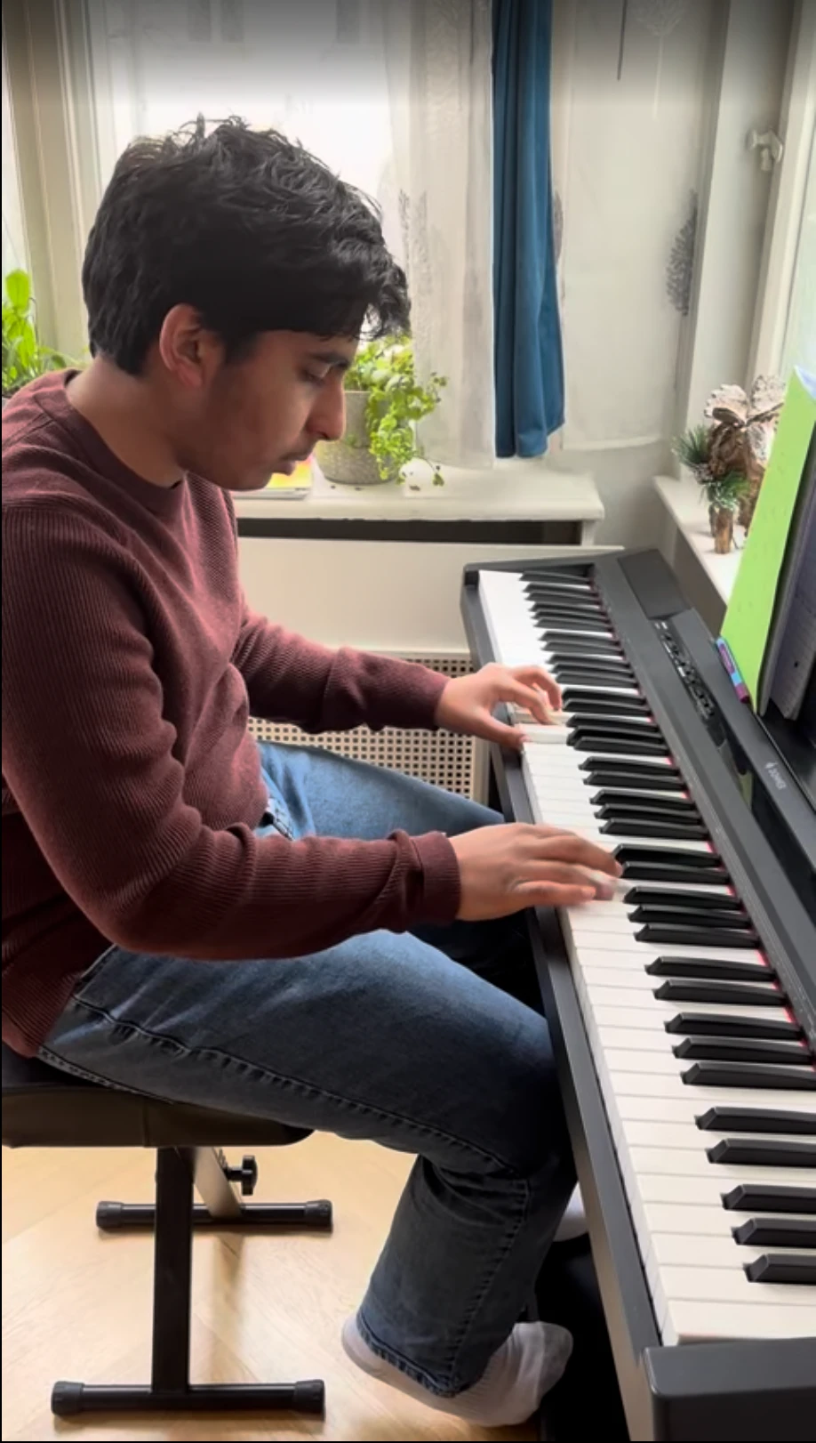 Parth playing piano at home