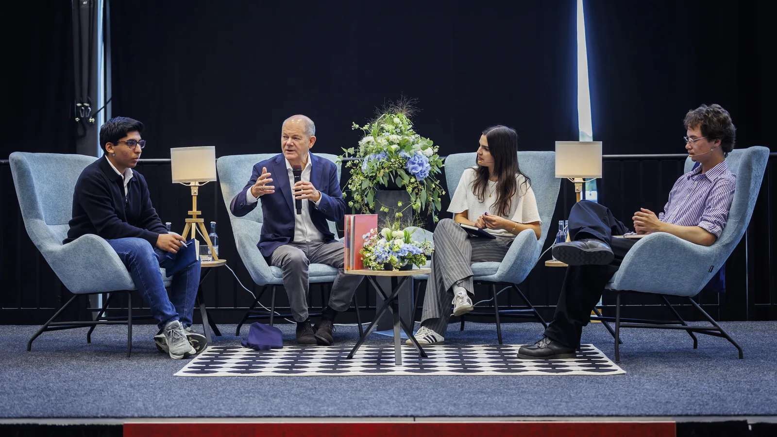 Panel interview with Olaf Scholz and three student moderators at BBIS Berlin